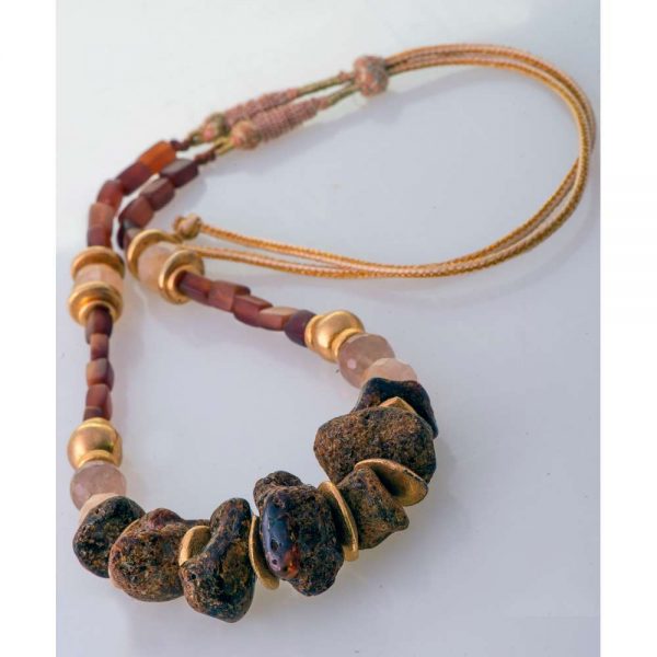 Handmade necklace with raw amber and gold elements